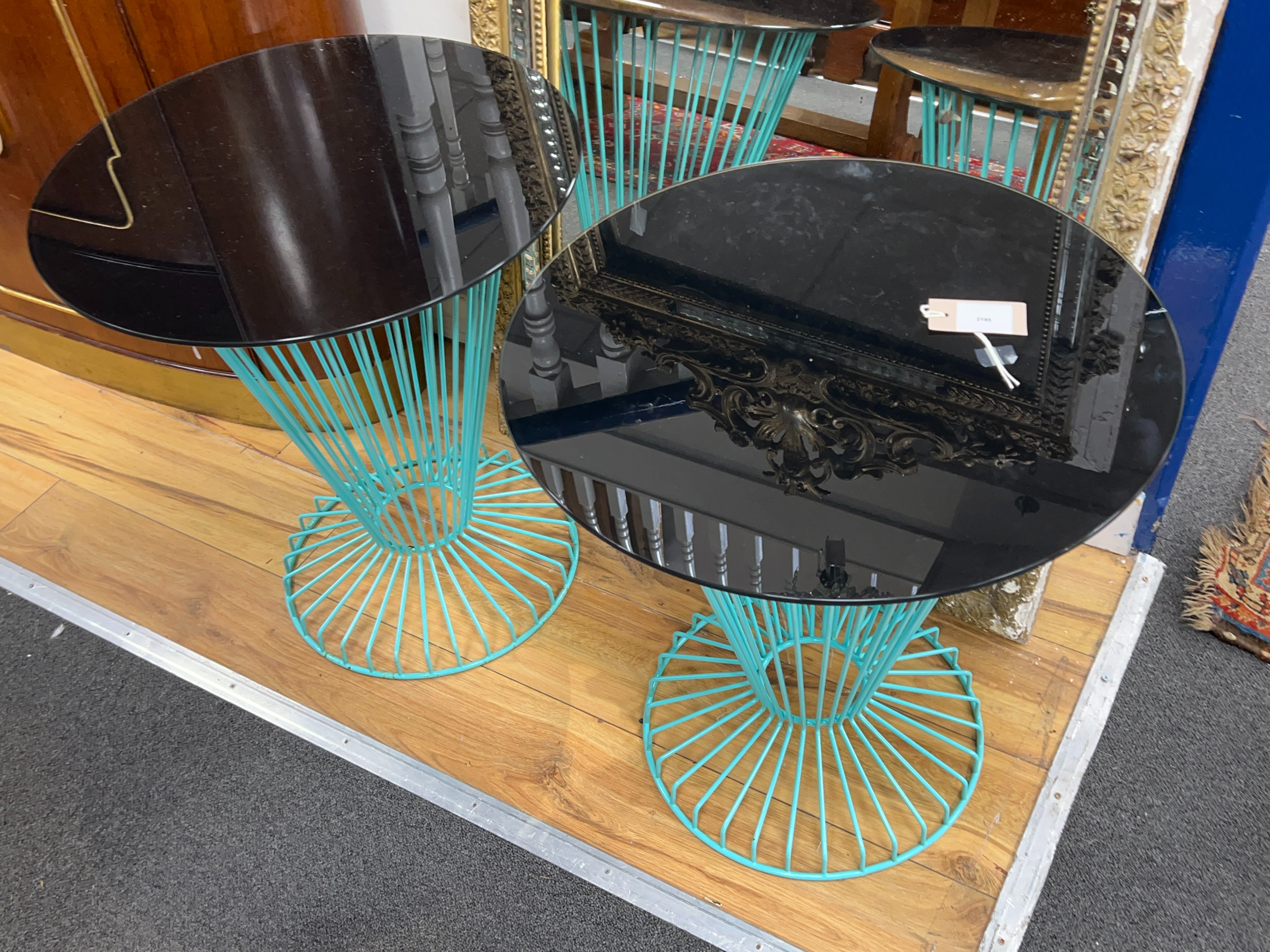 A pair of mid century style circular glass topped painted wrought iron occasional tables, diameter 50cm, height 56cm